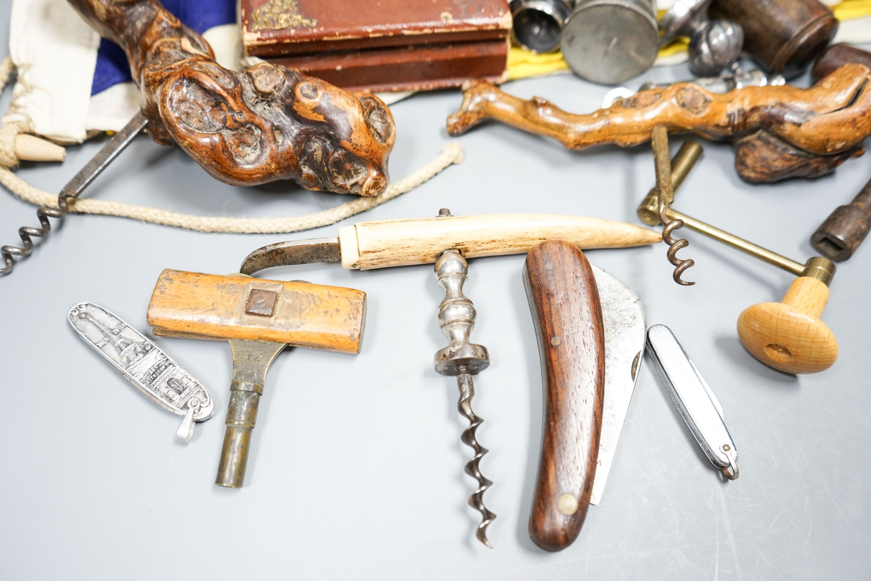 A carpenter's gauge stamped 'J. Waters', two rootwood-handled corkscrews, a Swiss clasp knife and sundry items